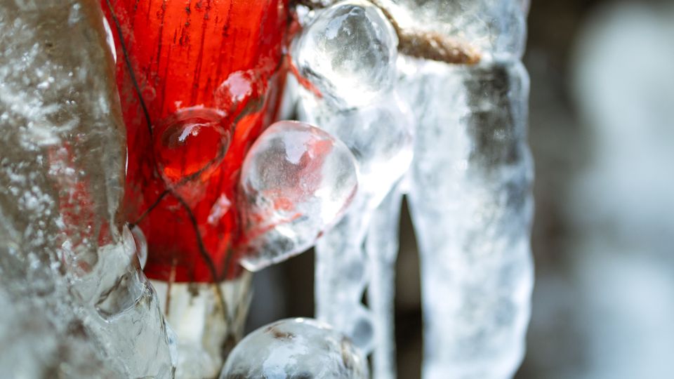 Ice forming on an exposed pipe in freezing weather